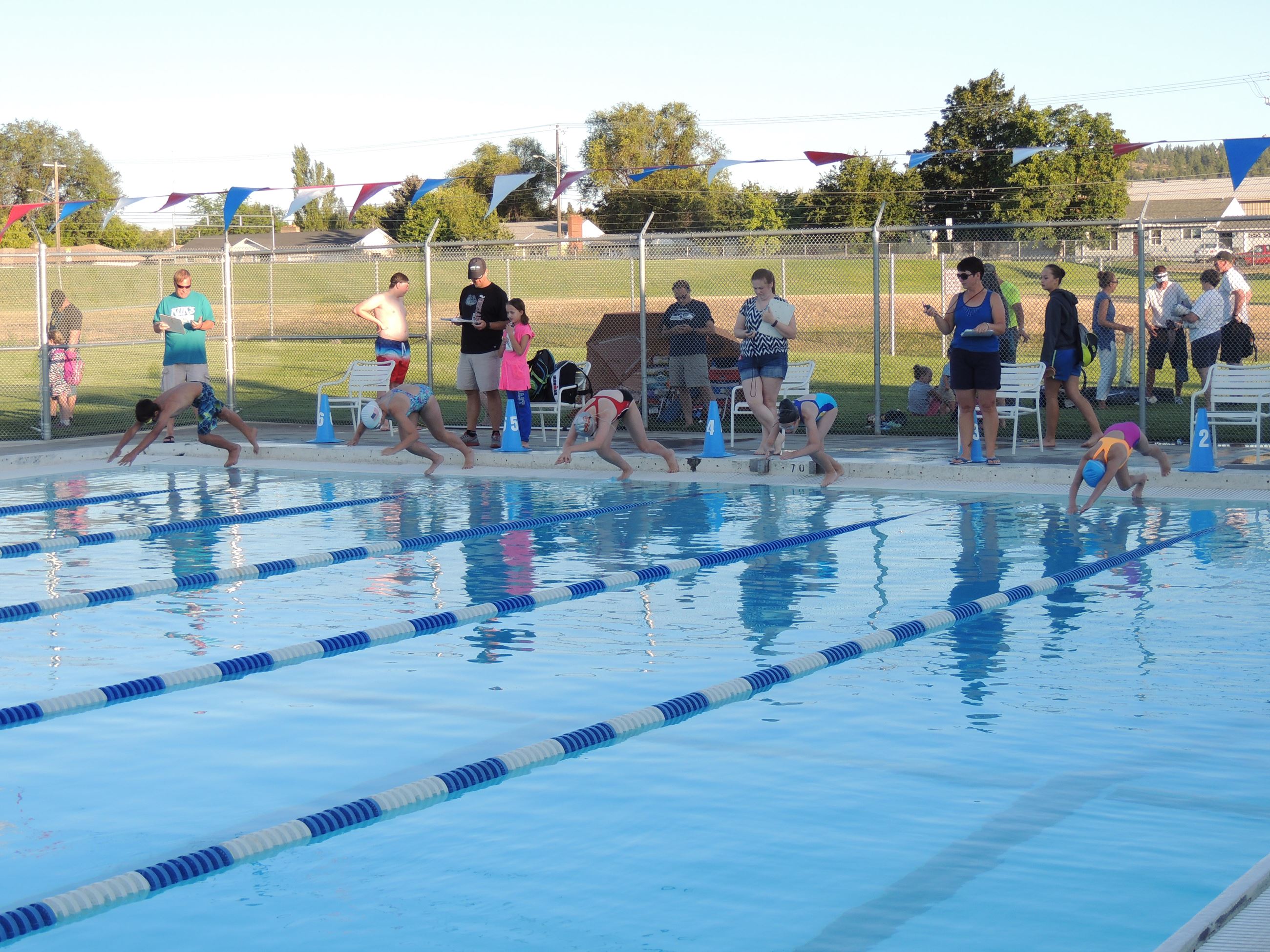 Kids preparing to dive for a race at the Valley Mission Pool.